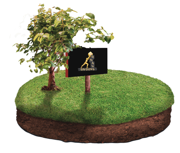 A small green sapling planted on a circular patch of grass-covered soil, with a signboard displaying the Udhay Groups logo in gold on a black background, set against a yellow gradient background.