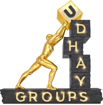 Udhay Groups logo featuring a golden human figure lifting a gold cube with the letter \x27U\x27, while the remaining letters \x27D\x27, \x27H\x27, \x27A\x27, and \x27Y\x27 are stacked on black blocks. The word \x27GROUPS\x27 is displayed at the bottom with illuminated text.